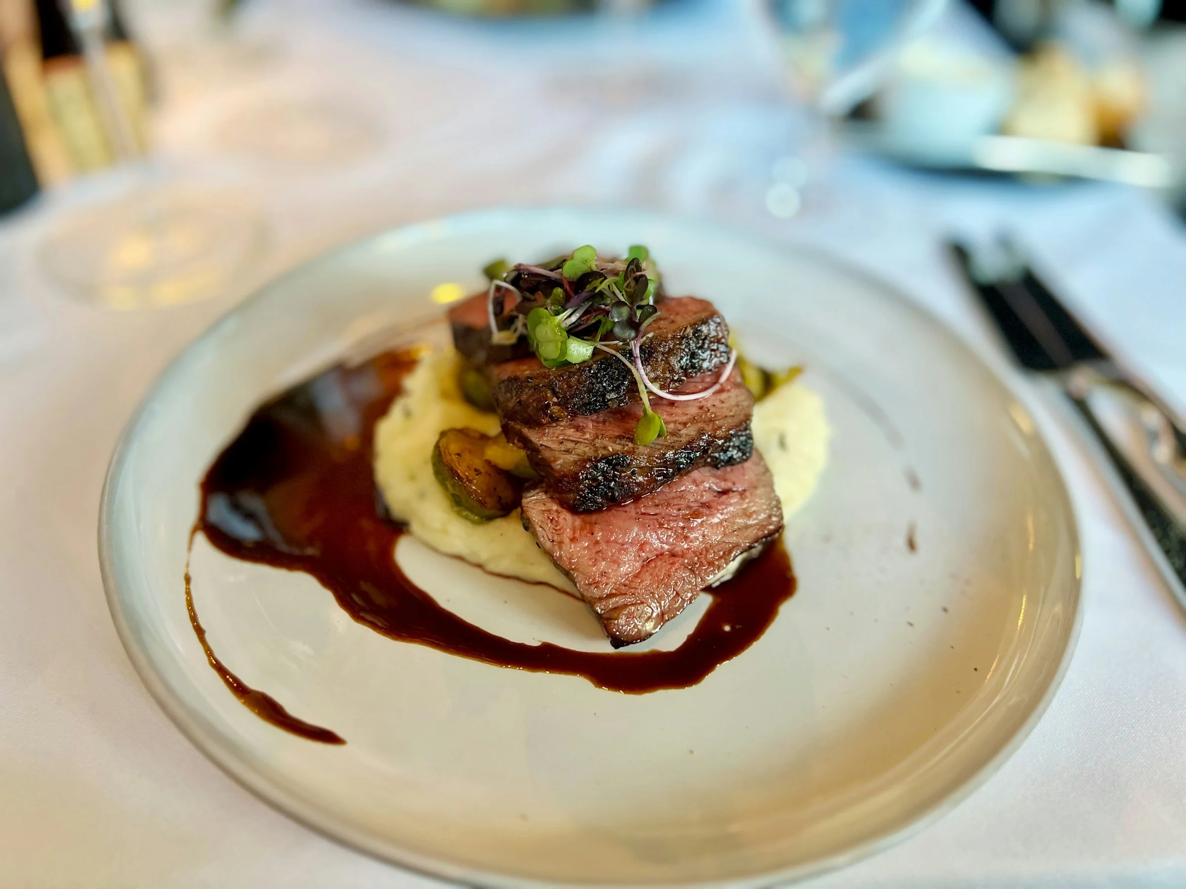 Roasted beef tenderloin with red wine reduction and truffle purée for a festive winter menu