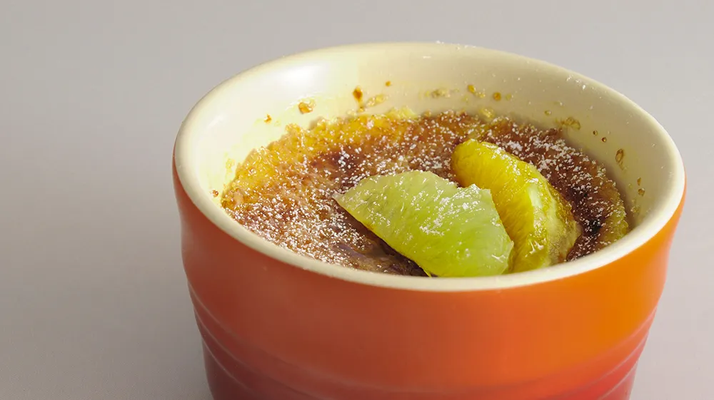 Crema catalana with lemon and orange segments.