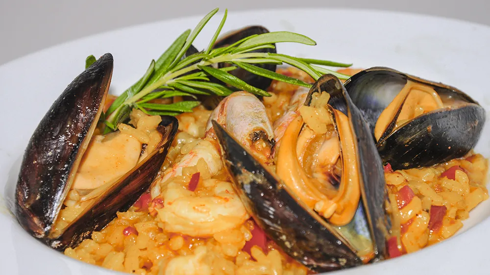 Paella with mussels and shrimp.