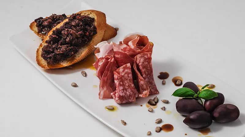 Tapas with Cured Meats and Tapenade on Toast